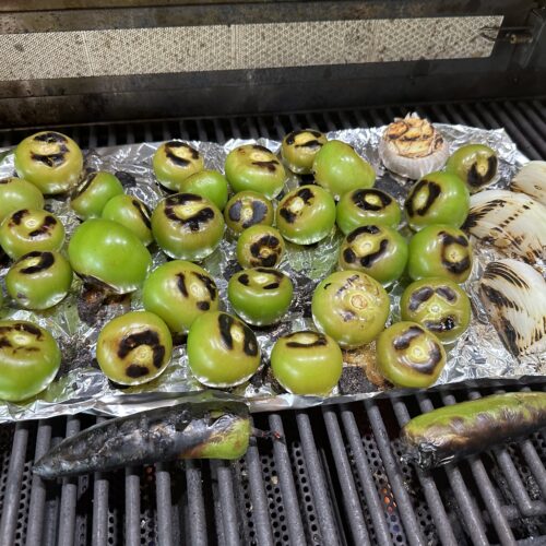 Fire Roasted Salsa Verde ingredients on the grill after charring